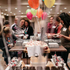 Guests help themselves to food at a Girls on the Run celebration